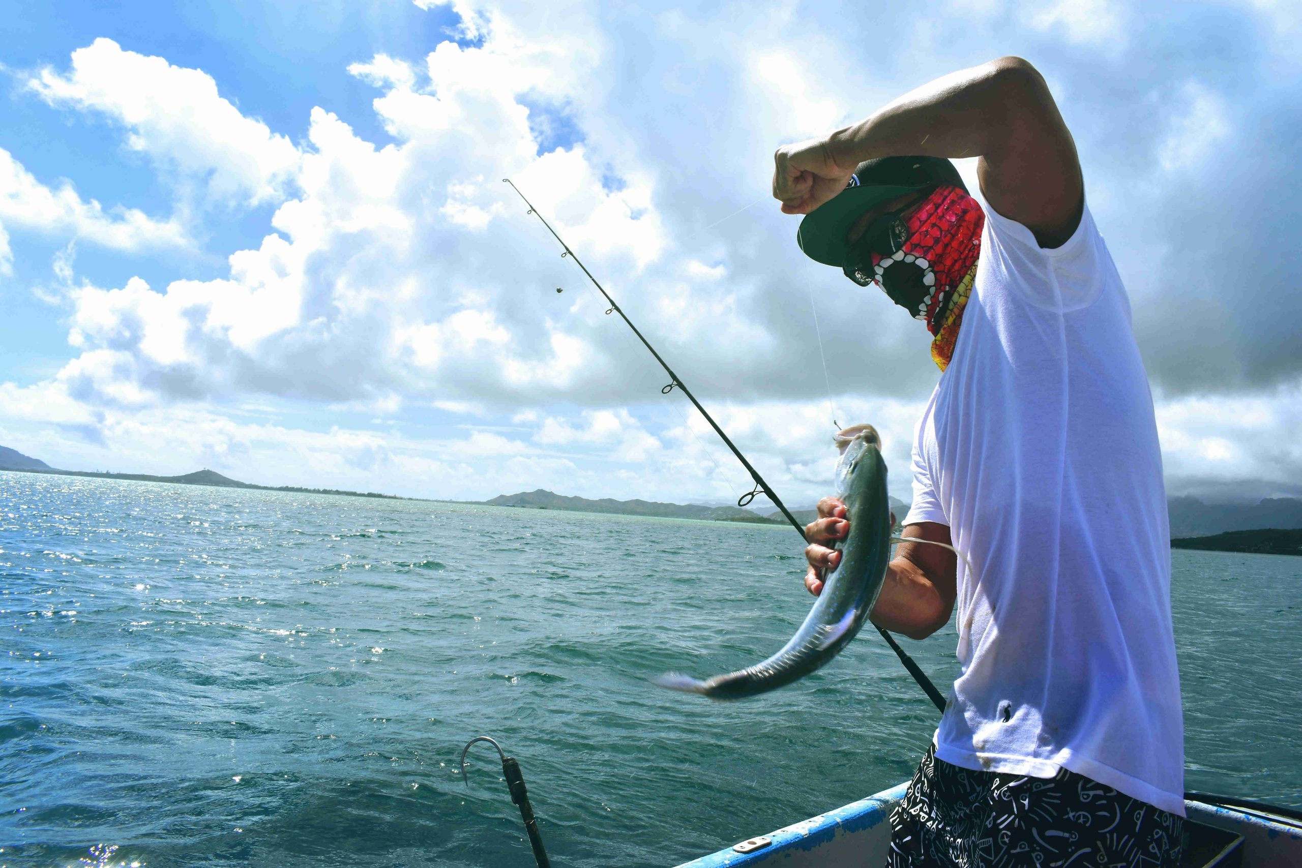 Angler reeling in fresh catch off of hte coast of Flamingo, Guanacaste, Costa Rica