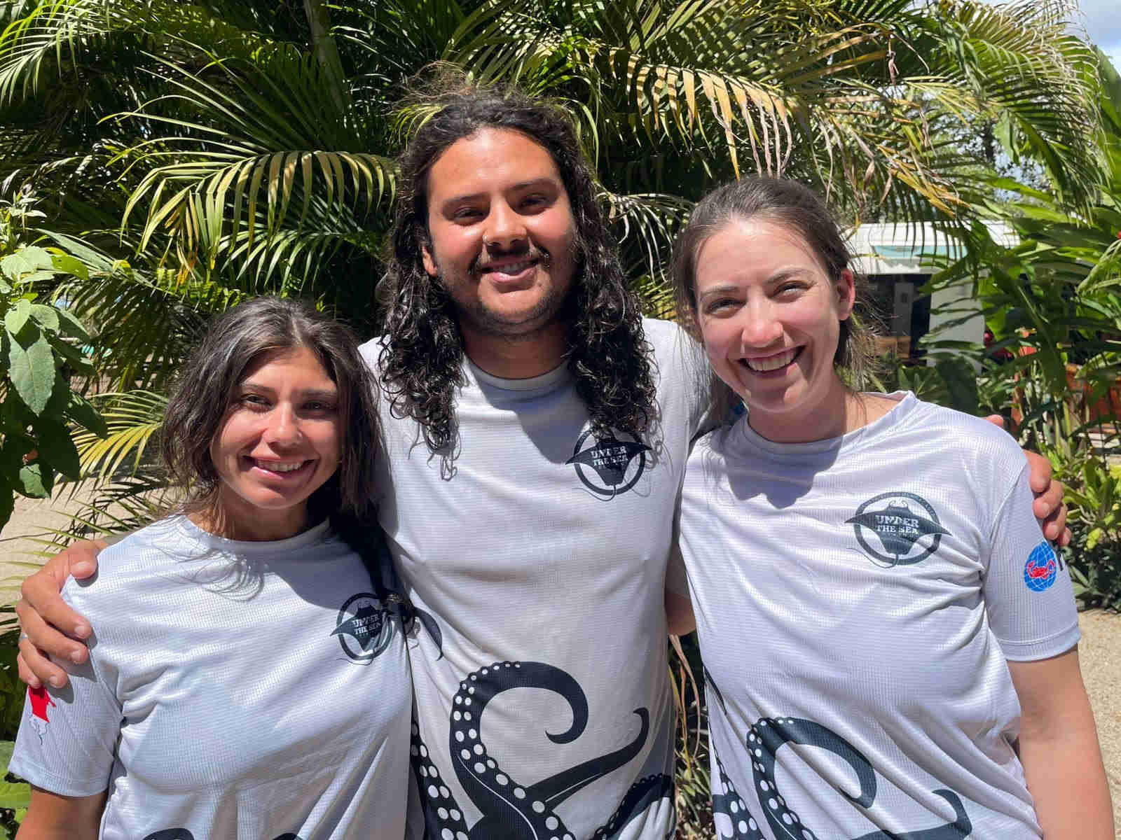 Two new PADI certified Divers with their PADI instructor Josue, in Playa Potrero, Costa Rica.