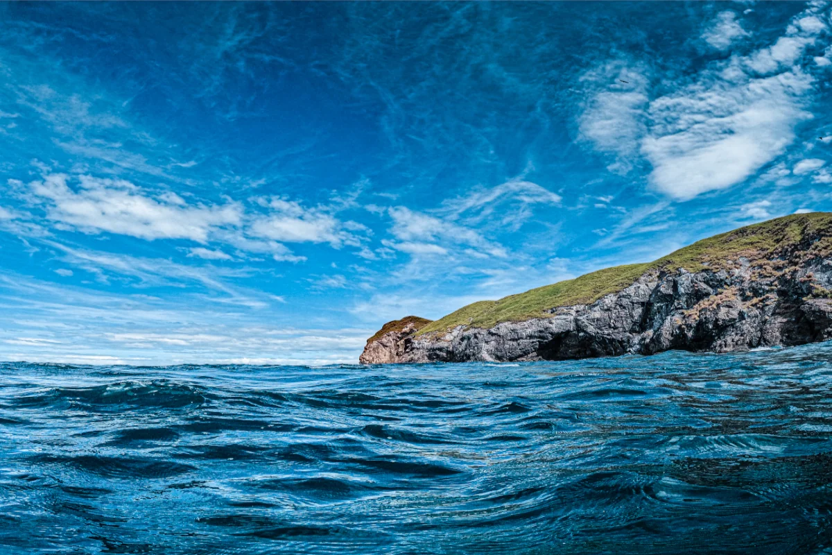 Water level view of the Catalina Islands volcanic rock formations rising from the Pacific Ocean, Guanacaste, Costa Rica.
