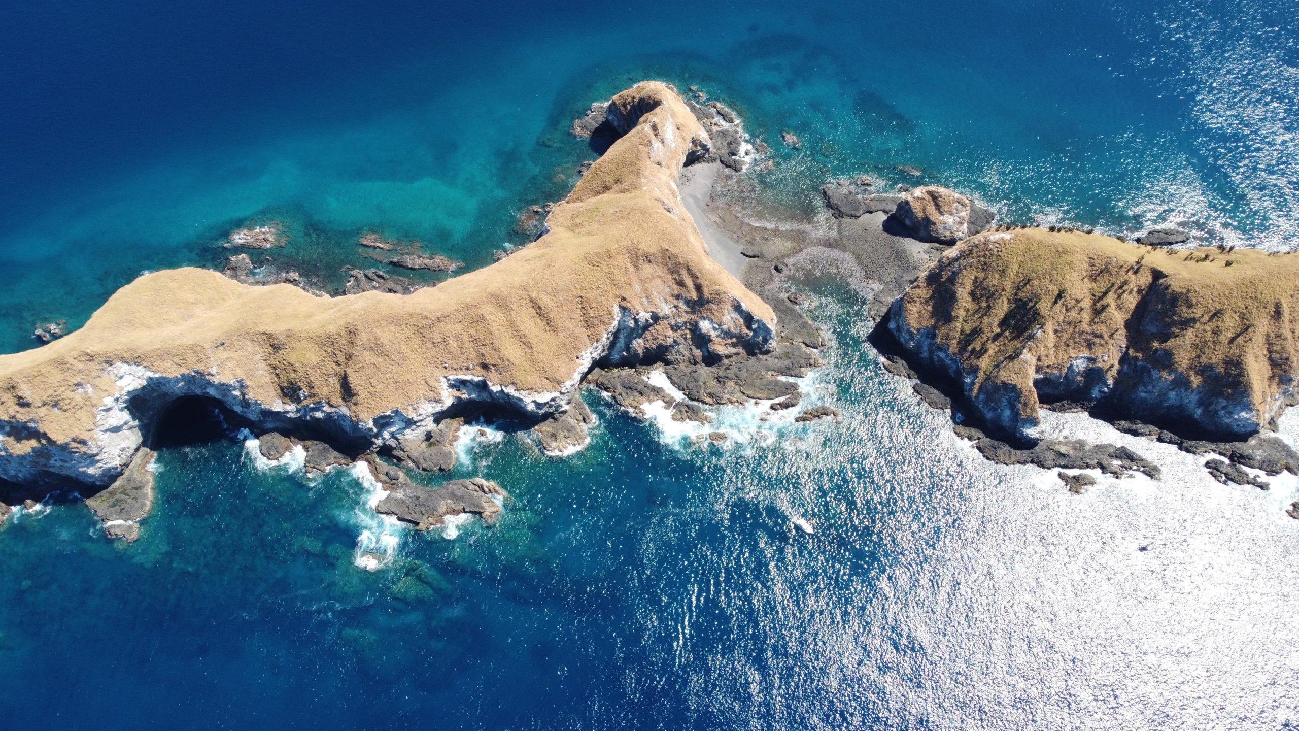 Aerial drone view of the Catalina Islands rocky ridge and volcanic formations rising from the Pacific Ocean, Guanacaste, Costa Rica.