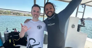 Josue, PADI dive instructor at Under The Sea Diving, with a newly certified diver in Playa Potrero, Costa Rica.