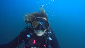 Smiling scuba diver underwater during a PADI course with Under The Sea Diving in Guanacaste, Costa Rica